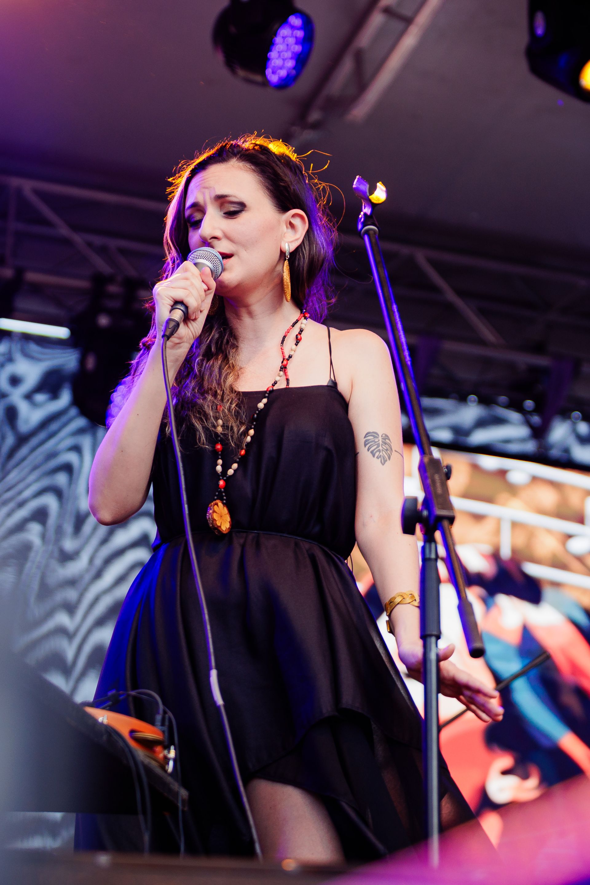 Mara Halunga singing in front of a festival crowd